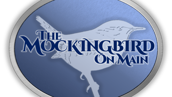 bird in an oval logo for the mockingbird on main theatre.