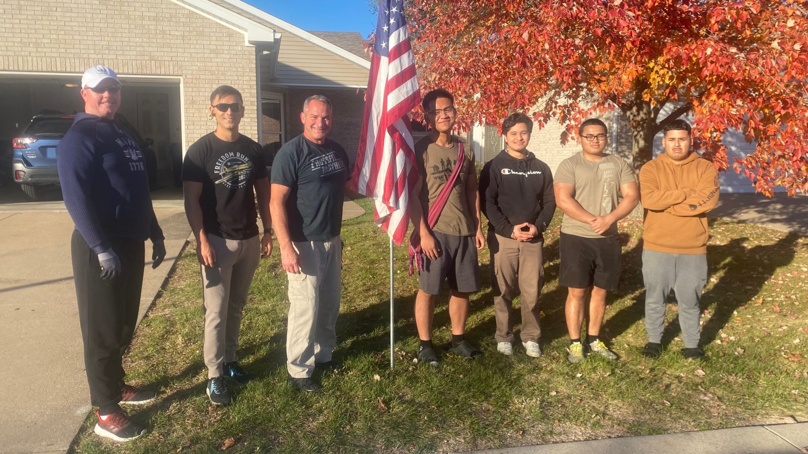 A new chapter after military service Group of people by american flag