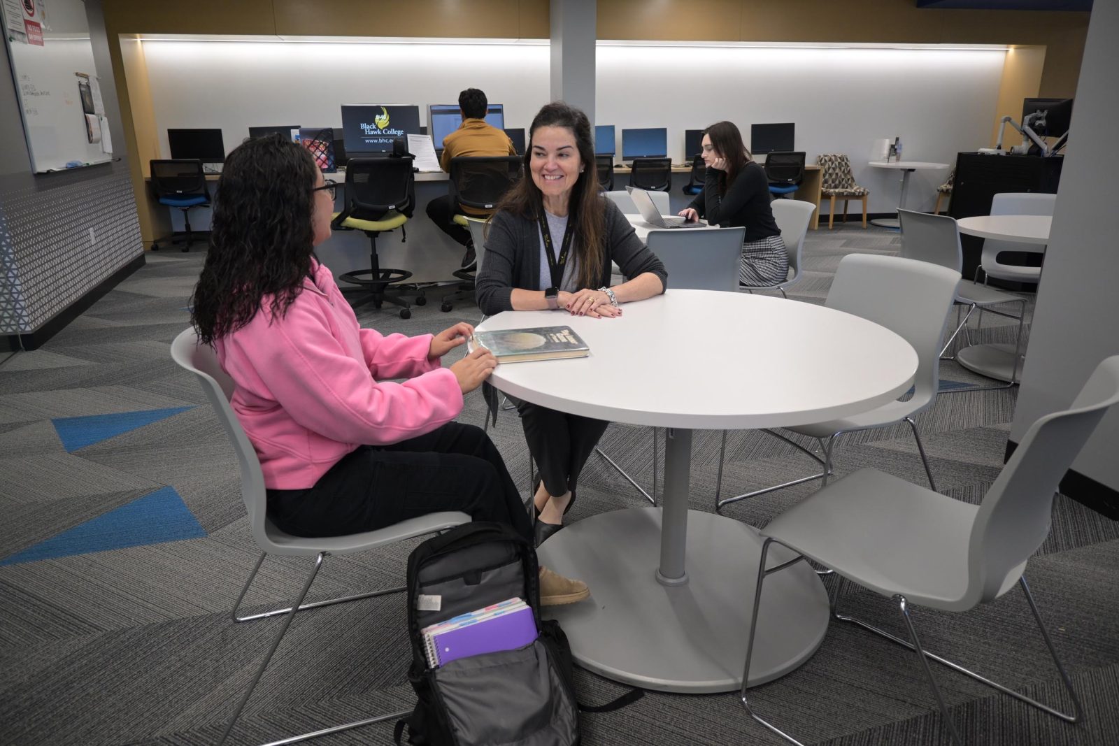 Tutoring Two students engaged in discussion.