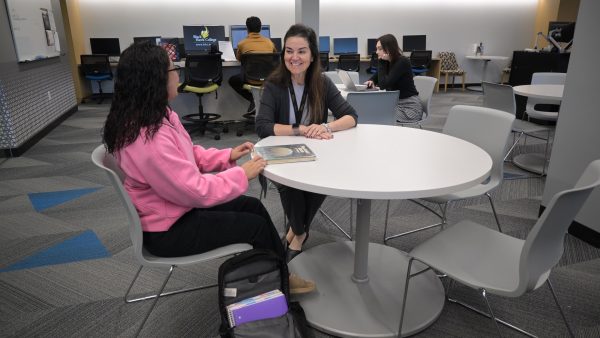 Two students engaged in discussion.