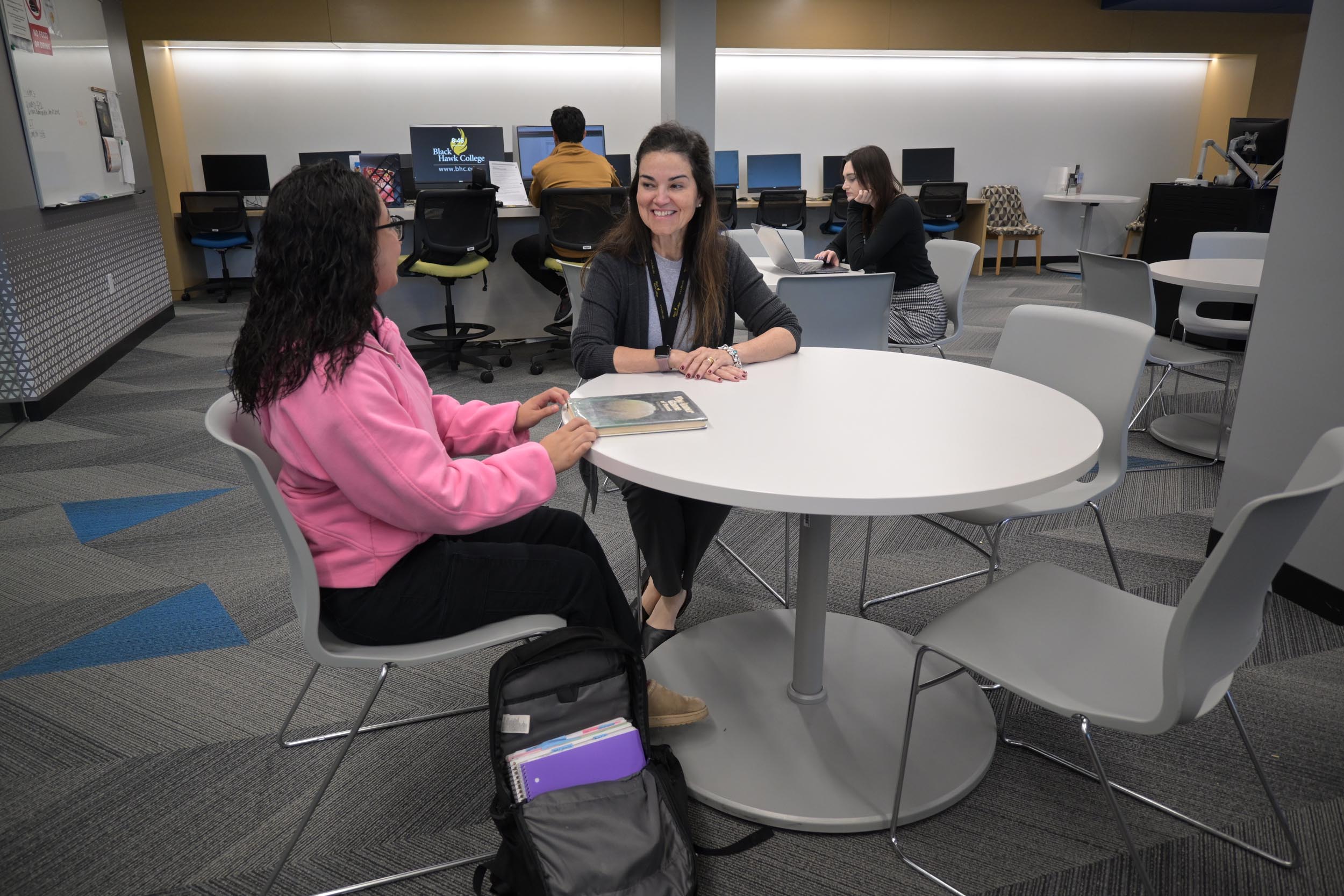 Two students engaged in discussion.