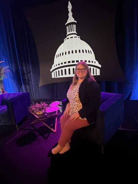 Makenna sitting in an interviewers chair