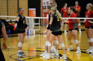 A group of women in volleyball uniforms