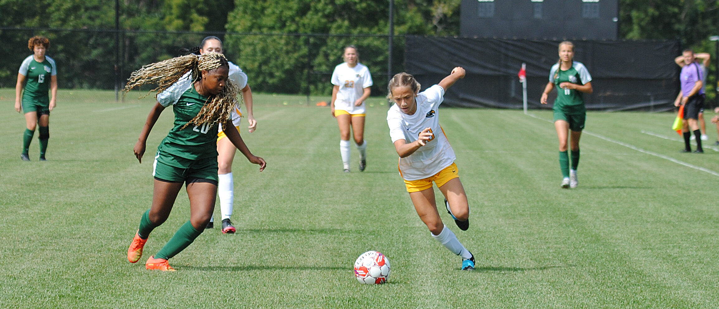 Women's soccer players on the field