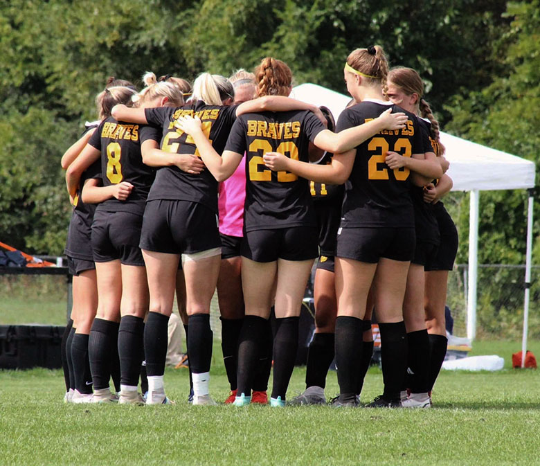 A group of children in a huddle