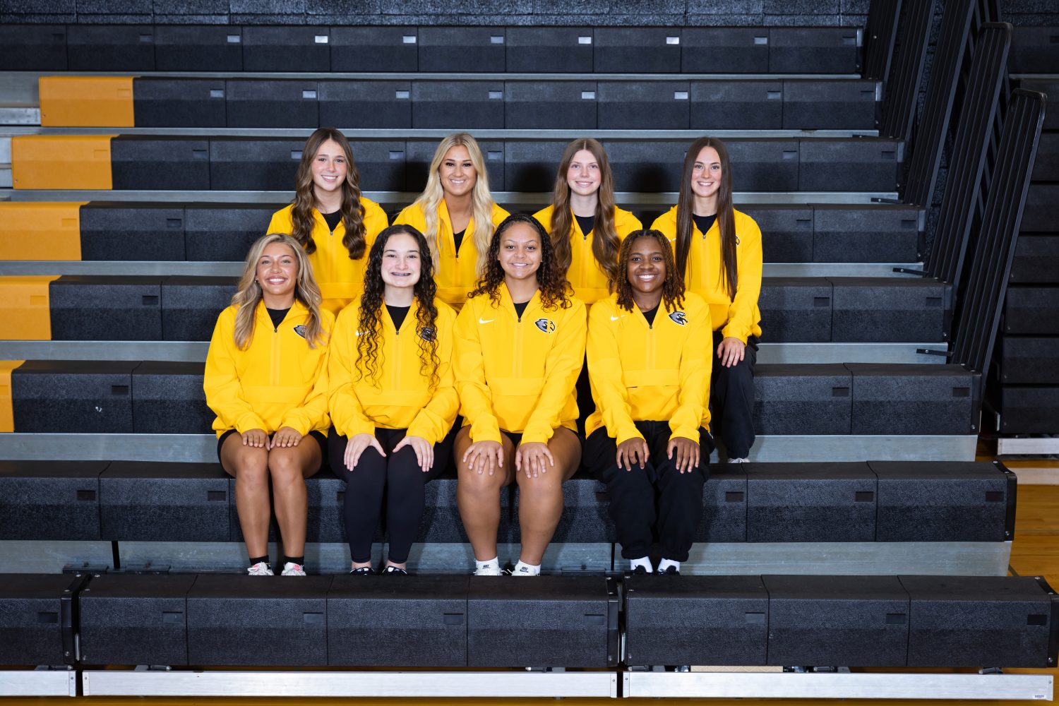 Team of women in yellow jackets