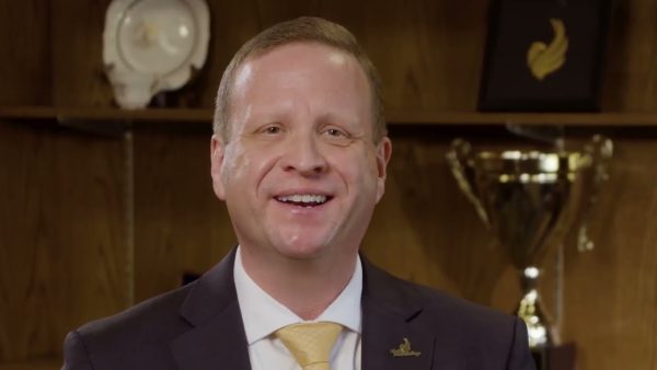 Man in suit smiling at camera