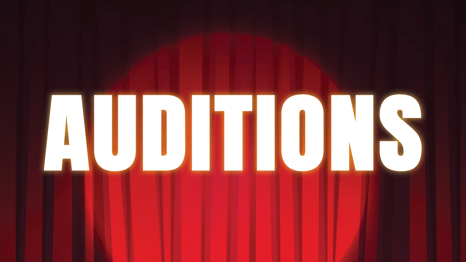 The word auditions on top of a stage theatre curtain and spotlight.