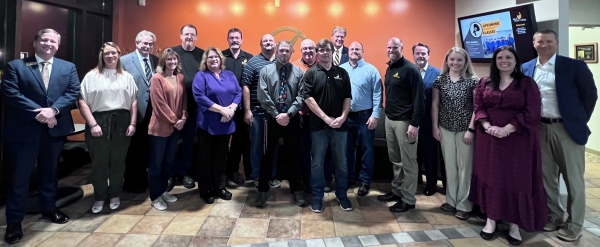 Employees honored with bhc coins of excellence 18 people standing in lobby of community education center in kewanee