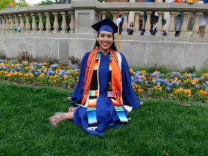 Smiling graduate wearing her cap and gown