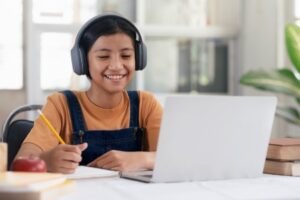 Girl studying at laptop computer