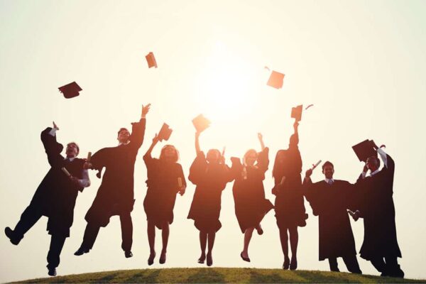 Grads throwing caps in the air
