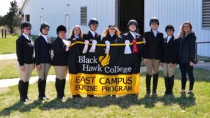 East campus equestrian riders holding bhc banner