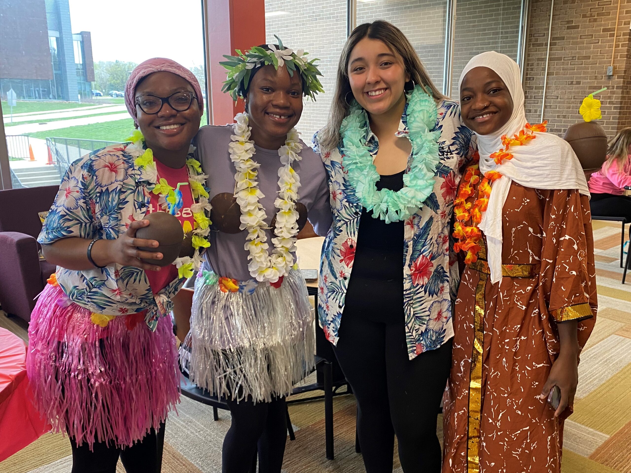 A group of women wearing colorful dresses