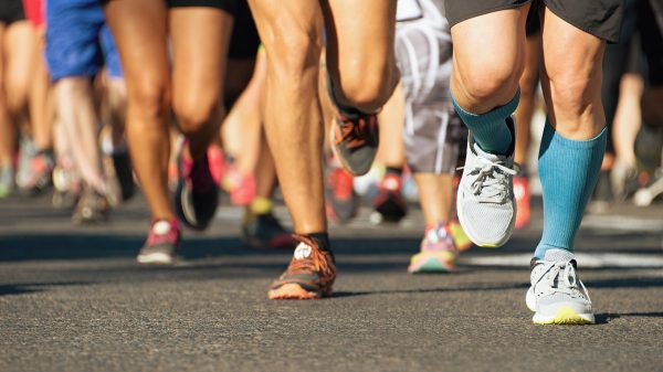 Close-up of runners' legs and feet.