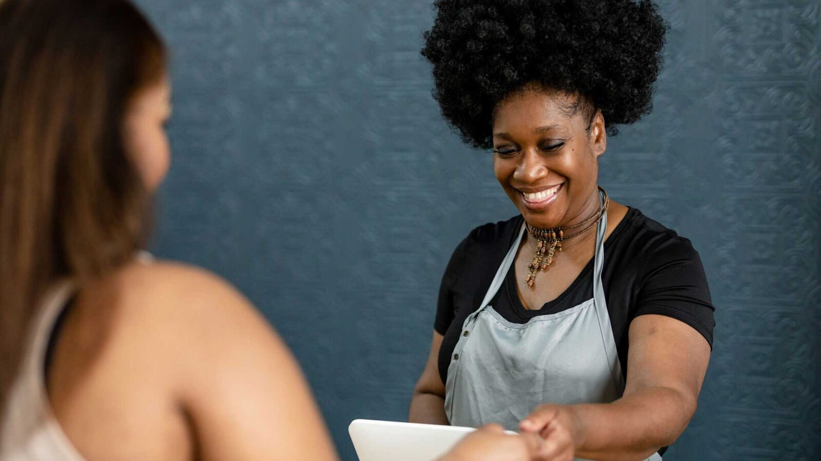 A person smiling at another person