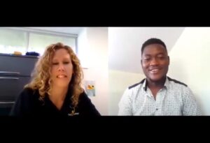 A woman and a man talking to each other during a zoom meeting